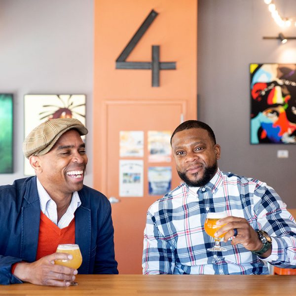 men enjoying beer in artful brewery