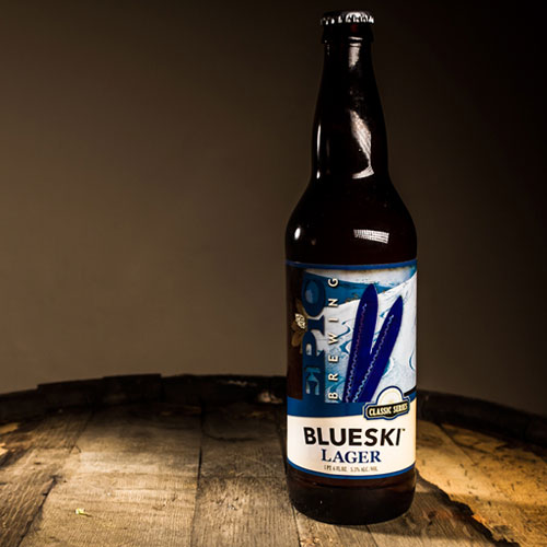 bluesky lager bottle resting on barrel
