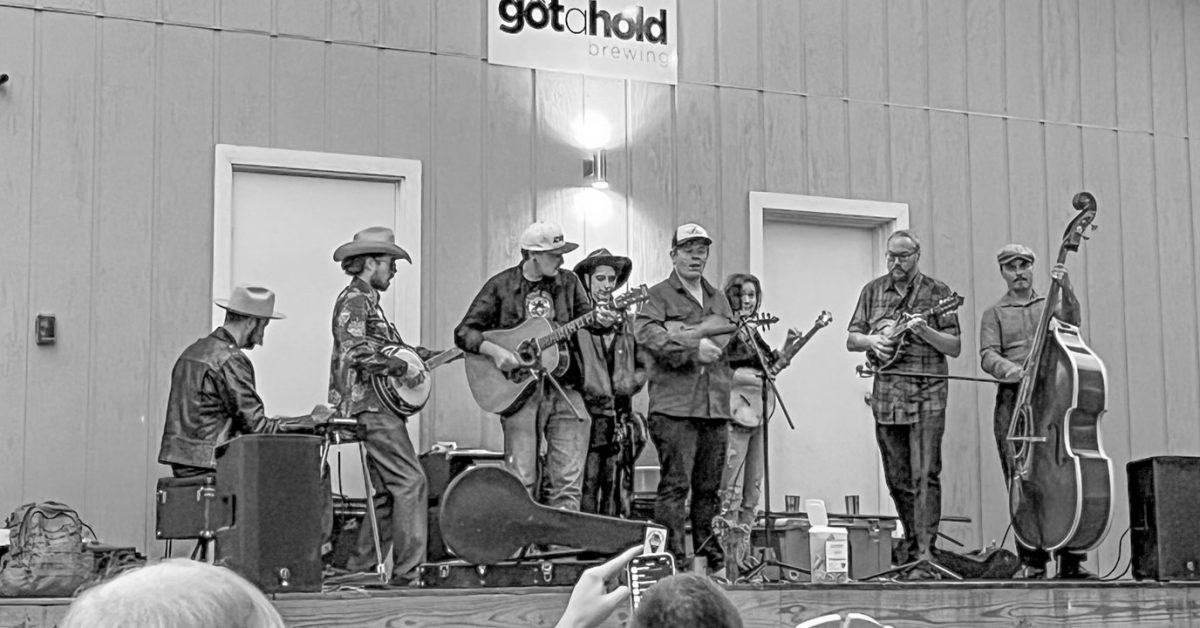 https://cdn.craftbeer.com/wp-content/uploads/20230411113242/bluegrass-band-on-stage-at-brewery-1200x628.jpg