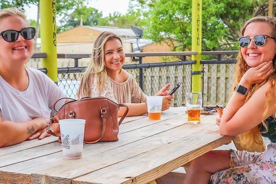 women enjoying beers on brewery patio