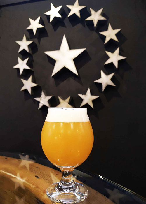 hazy ipa with 14th star brewing logo in background