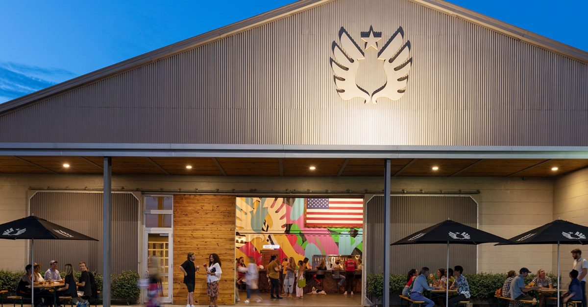 service brewery exterior with tables and patrons