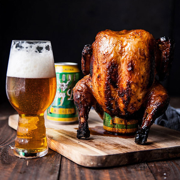 stone enjoy by ipa can in glass with cooked chicken over beer can