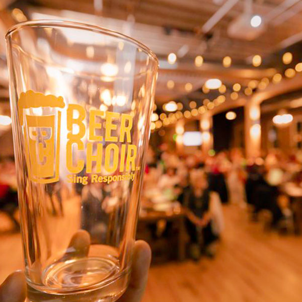 beer choir glass held at choir practice