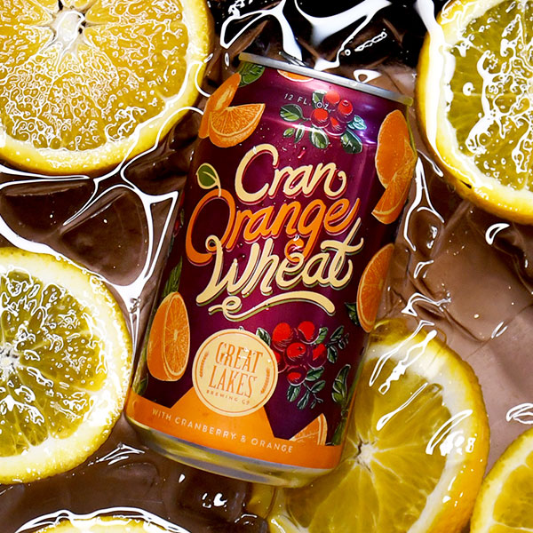 cran orange wheat beer with oranges and ice background