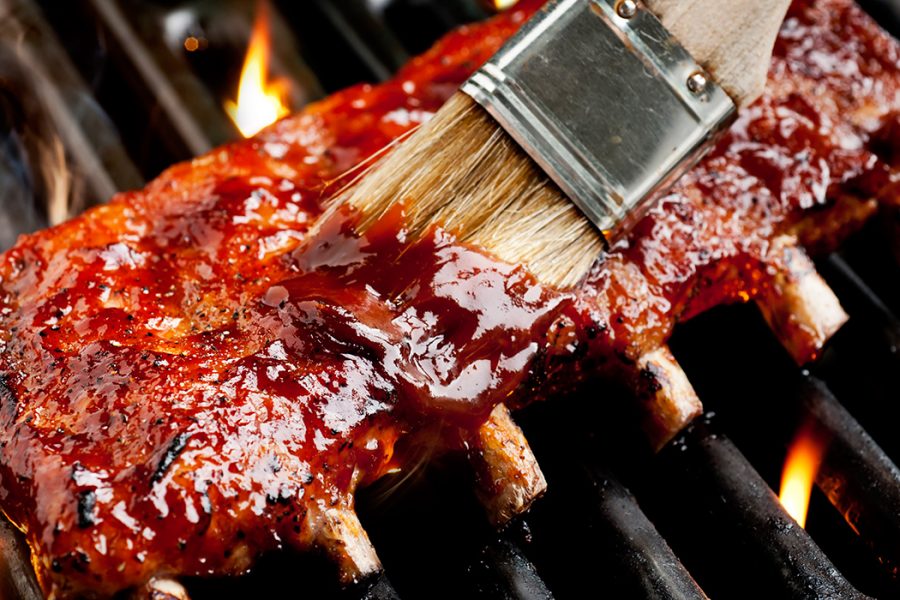  glazed bbq ribs being brushed