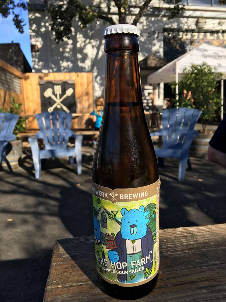 Fünke Hop Farm bottle on table outside.